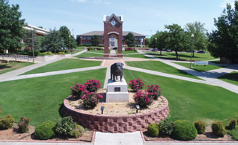 southwestern Oklahoma state university campus lawn with mascot statue in middle of frame